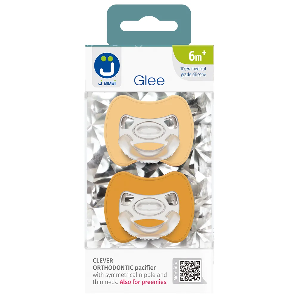 Verpakking met twee J Bimbi speen modellen in gele tinten uit de Glee collectie voor 6 maanden en ouder, zichtbaar in transparante blisterverpakking, verkrijgbaar bij Happy Kids Boutique en ontwikkeld met aandacht voor comfort en duurzaamheid.